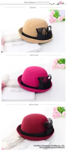 Eleganti cappelli cloche in lana con fiocchi in rete nei colori cammello, magenta e vino