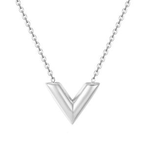Macro shot of silver V-shaped pendant necklace on a clean white background