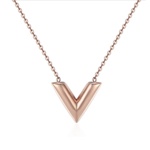 Detail shot of a rose gold V-shaped pendant necklace with a delicate chain on white background