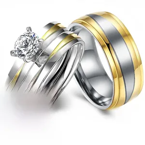 Detail view of two-tone silver and gold stainless steel couple rings with round cut stone