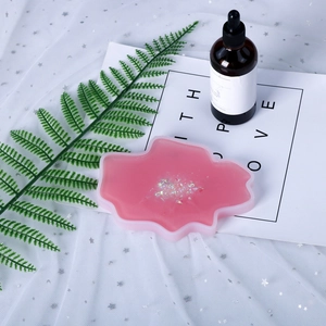 Irregular pink cloud resin coaster mold with colorful iridescent sequins and leaf decor