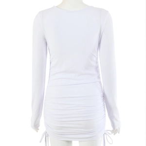 Detail view of white ribbed knit dress back with side drawstrings and ruched texture