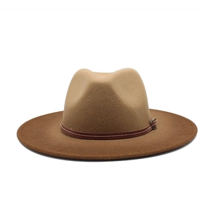 Close-up of brown wool fedora hat featuring a wide brim and classic leather decorative band