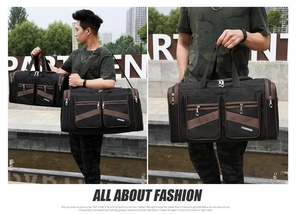 Detail showing high-capacity black foldable travel bag with reinforced straps and zippers