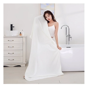 Thickened white coral fleece bath towel with waffle texture for high water absorption