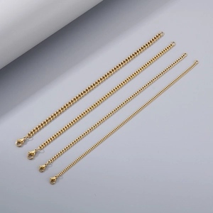 Detail view showing four different thicknesses of polished golden Cuban link chains