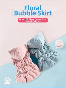 Close-up of floral bubble dog dress with quilted texture and ruffle hem detail