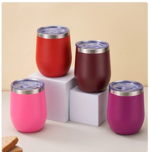 Selection of stainless steel egg-shaped tumblers in red, pink, and purple with clear lids