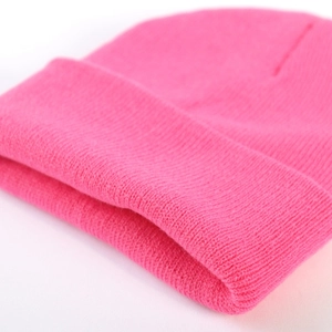 Classic ribbed knit beanie hat in neon pink with folded cuff for winter warmth