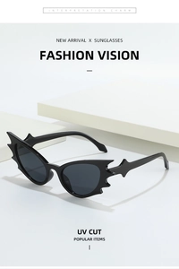 Detail of bat-wing shaped cat eye sunglasses with high-quality dark lenses and UV protection