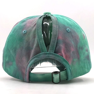 Detail of tie-dye cotton baseball cap with ponytail hole and adjustable metal buckle back