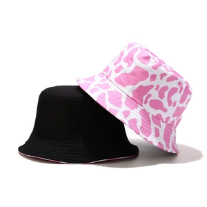 Pink and white cow print bucket hat with a classic solid black cotton sun hat