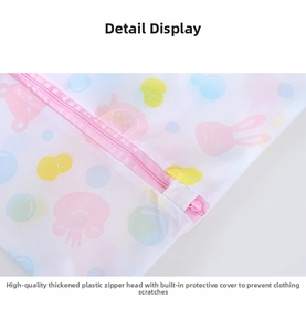 Detail of durable laundry bag featuring fine mesh fabric and pink plastic zipper with cover