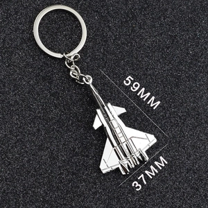 Silver metal jet fighter plane keychain with 59mm length and 37mm wingspan dimensions