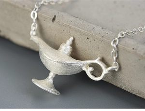 Macro shot of the matte frosted S925 sterling silver Aladdin lamp pendant necklace