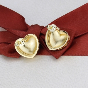 Detailed close-up of 18k gold plated heart earrings showing back posts and secure clasps