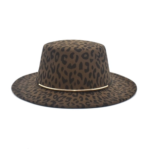 Close-up of leopard print wool felt hat with an elegant gold metal decorative band