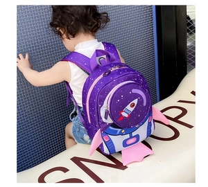 Detail of toddler rocket backpack showing purple space theme and safety leash attachment