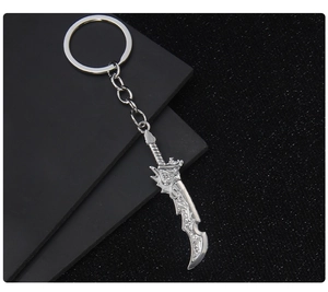 Detailed close-up of a silver metal dragon sword keychain model on a dark background