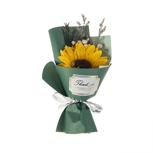 Artificial sunflower bouquet with baby's breath and eucalyptus in green gift wrapping