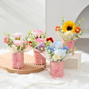 Handmade crochet flower bouquets in pink gift cylinders with ribbons and pearls