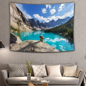 Close-up of a wall tapestry featuring a majestic mountain lake and snowy peak scenery