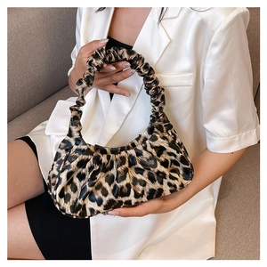 Detail of leopard print cloud bag with ruched handle and vintage pleated texture