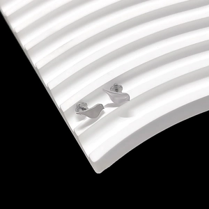 Macro view of silver bird-shaped titanium steel stud earrings on white wavy texture