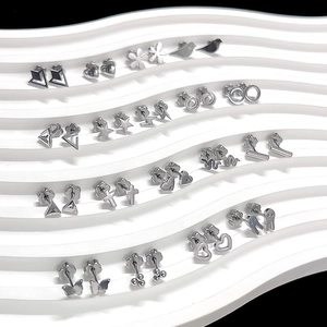 Detailed view of collection featuring silver heart, butterfly, and star titanium earrings