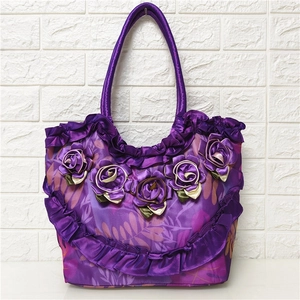 Purple satin tote bag for women featuring handmade 3D floral accents and leaf patterns