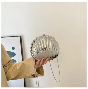 Chic silver seashell evening clutch bag with metallic finish and thin chain strap