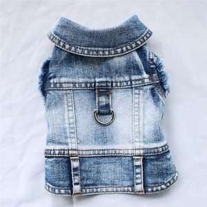 Washed blue denim pet vest jacket with metal D-ring leash attachment and frayed edges