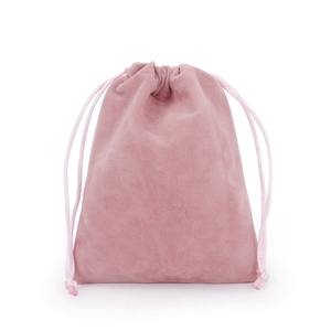 Detailed macro view of a pink velvet drawstring pouch with soft texture and woven cord