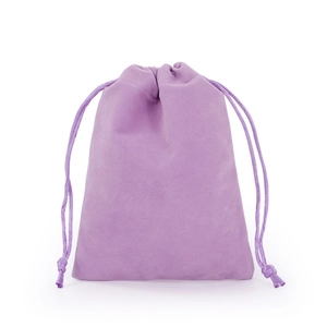 Detailed view of a purple velvet drawstring pouch showing soft fabric texture and cord