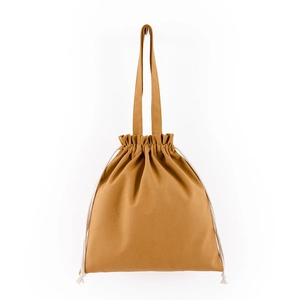 Detailed view of tan drawstring canvas bag with cotton rope closure and top handles
