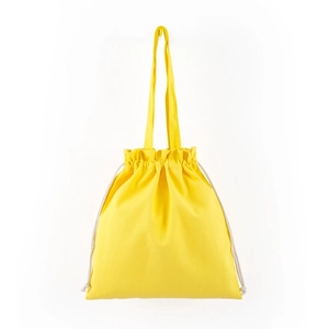 Detail of yellow canvas tote bag with drawstring closure and sturdy handles