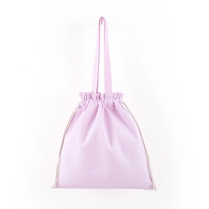 Detailed view of pink cotton canvas drawstring bag with sturdy fabric handles and cords