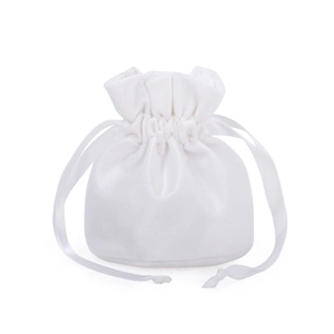 Detailed view of white velvet drawstring gift bag with elegant satin ribbon closure