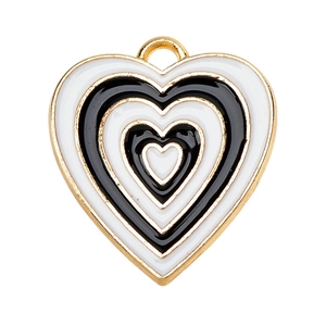 Detail of layered black and white heart enamel pendant with gold metal edges
