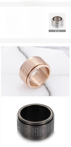 Detail view of rotating stainless steel rings with Buddhist heart sutra in gold, black, and silver