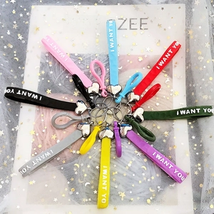 Macro shot of colorful heart silicone lanyards with I WANT YOU text and metal hooks