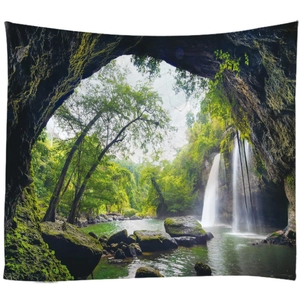 Tenture murale paysage avec vue sur une cascade majestueuse depuis une grotte rocheuse