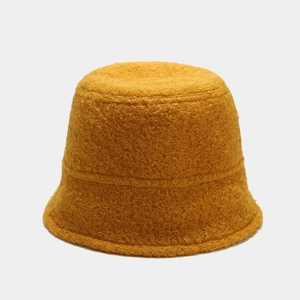 Detailed texture of yellow faux shearling lamb wool on a vintage winter bucket hat