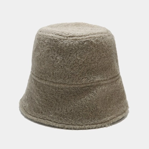 Close-up of oatmeal plush bucket hat showing premium faux shearling texture and soft fabric