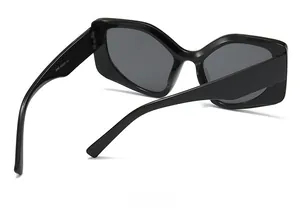 Detailed back view of oversized black fashion sunglasses with product code markings