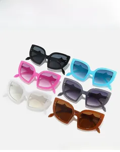 Detailed display of oversized cat-eye sunglasses with metal rivets in six various colors