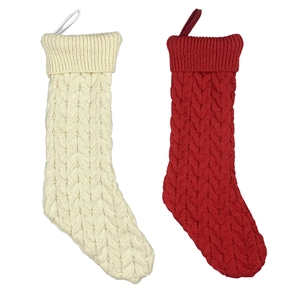 Classic cable knit Christmas stockings in red and cream white with hanging loops