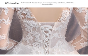 Dettaglio dell'abito da sposa bianco con ricami in pizzo e classico schienale stringato