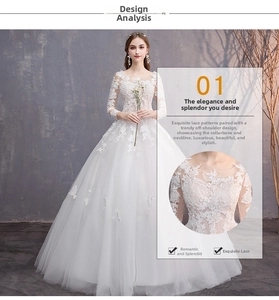 Dettaglio delle eleganti maniche lunghe in pizzo bianco e del corpetto dell'abito da sposa