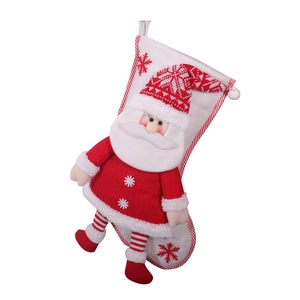 Red and white knitted Christmas stocking with a 3D Santa Claus doll and snowflake patterns